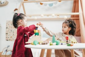 Children of different nationalities playing with building blocks