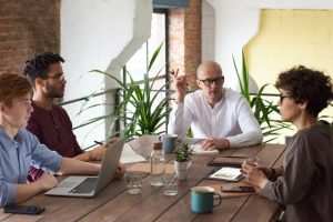 Co workers round table in a business meeting