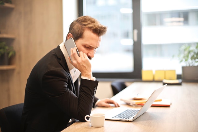 Man looking unhappy on phone call